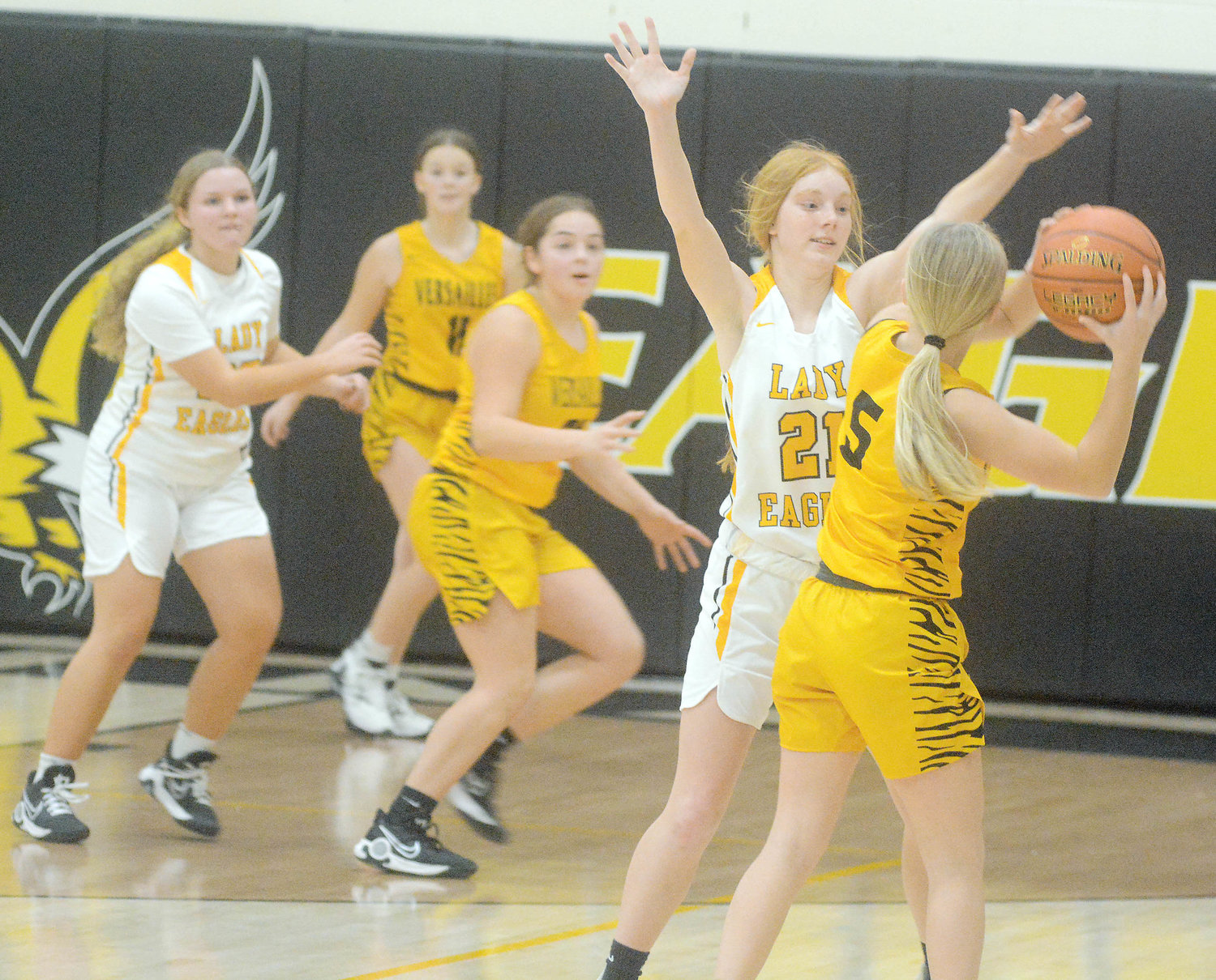 Madison Weeks (far right) plays defense against Versailles’ Lady Tigers. Both Vienna’s Lady Eagle and Eagle basketball teams will look to snap losing streaks to start 2023.